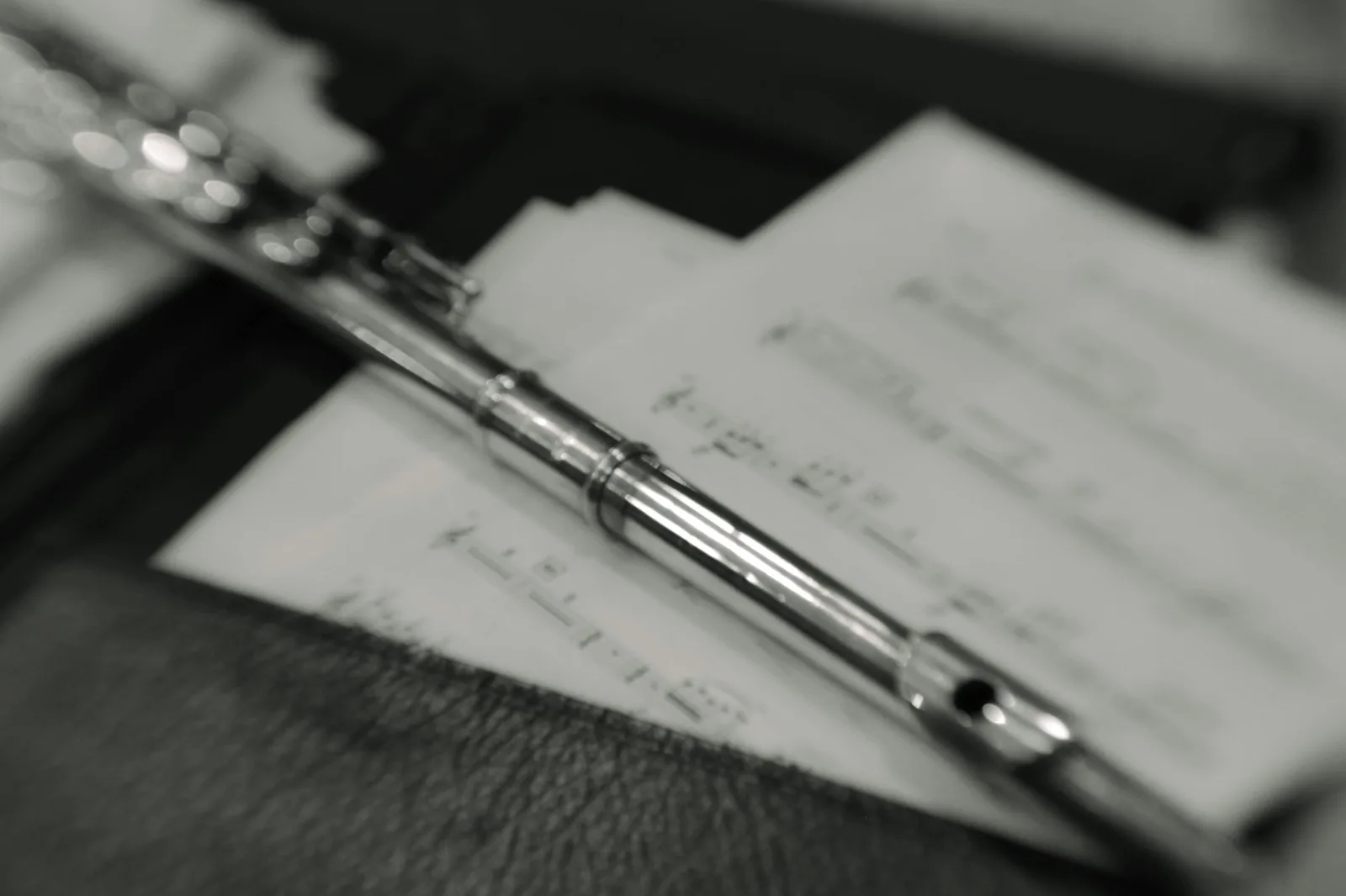 An open folder of records and handwritten notes