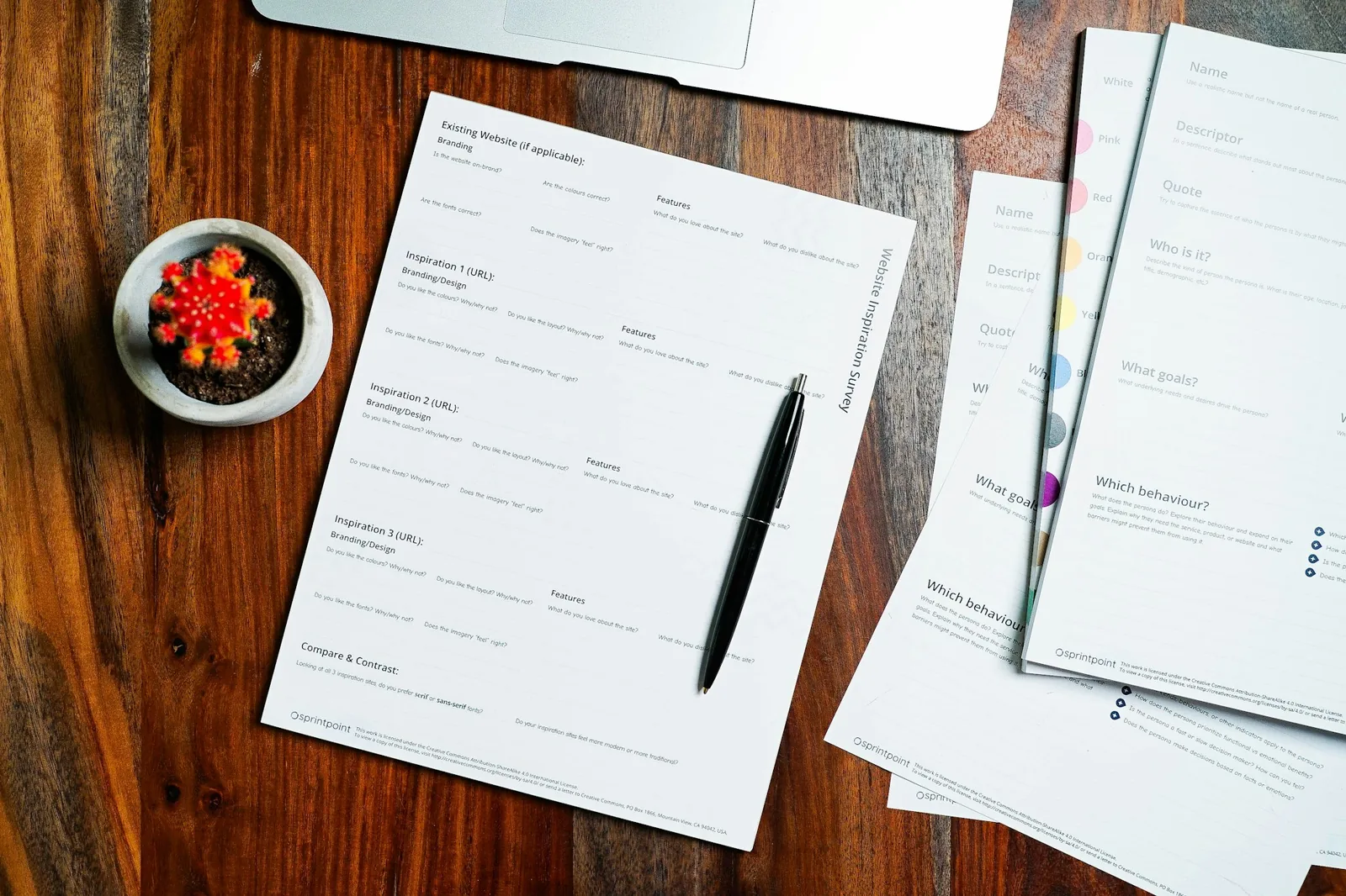 Legal documents laid out on a table with a pen