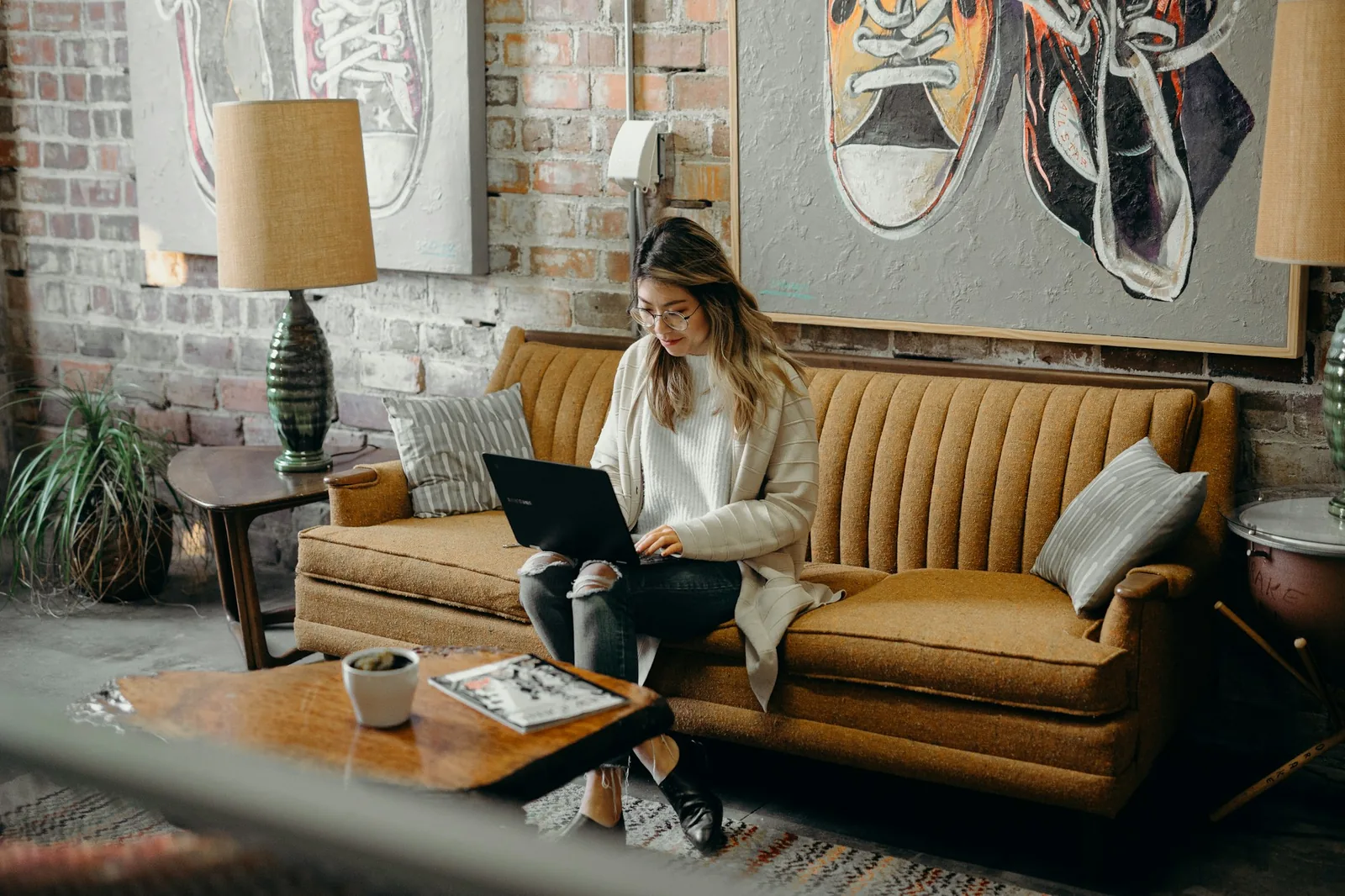 A person looking at a laptop screen while researching online