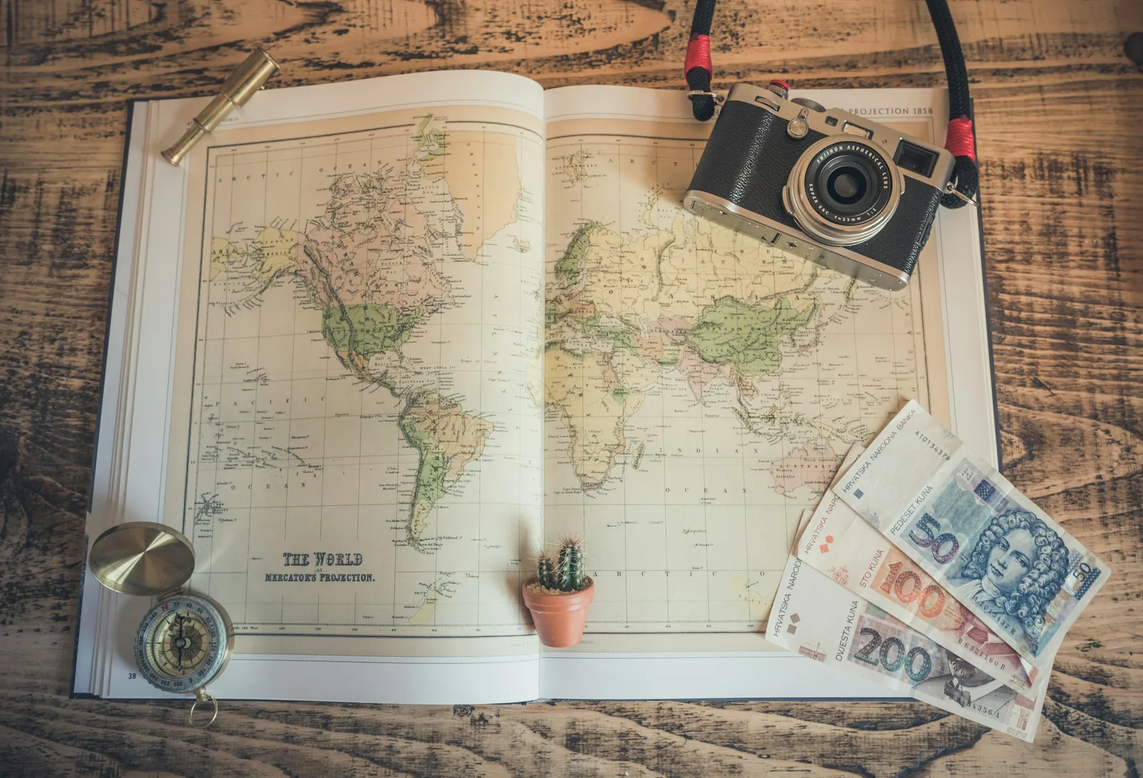 A paper map spread out on a table with a pen resting on it