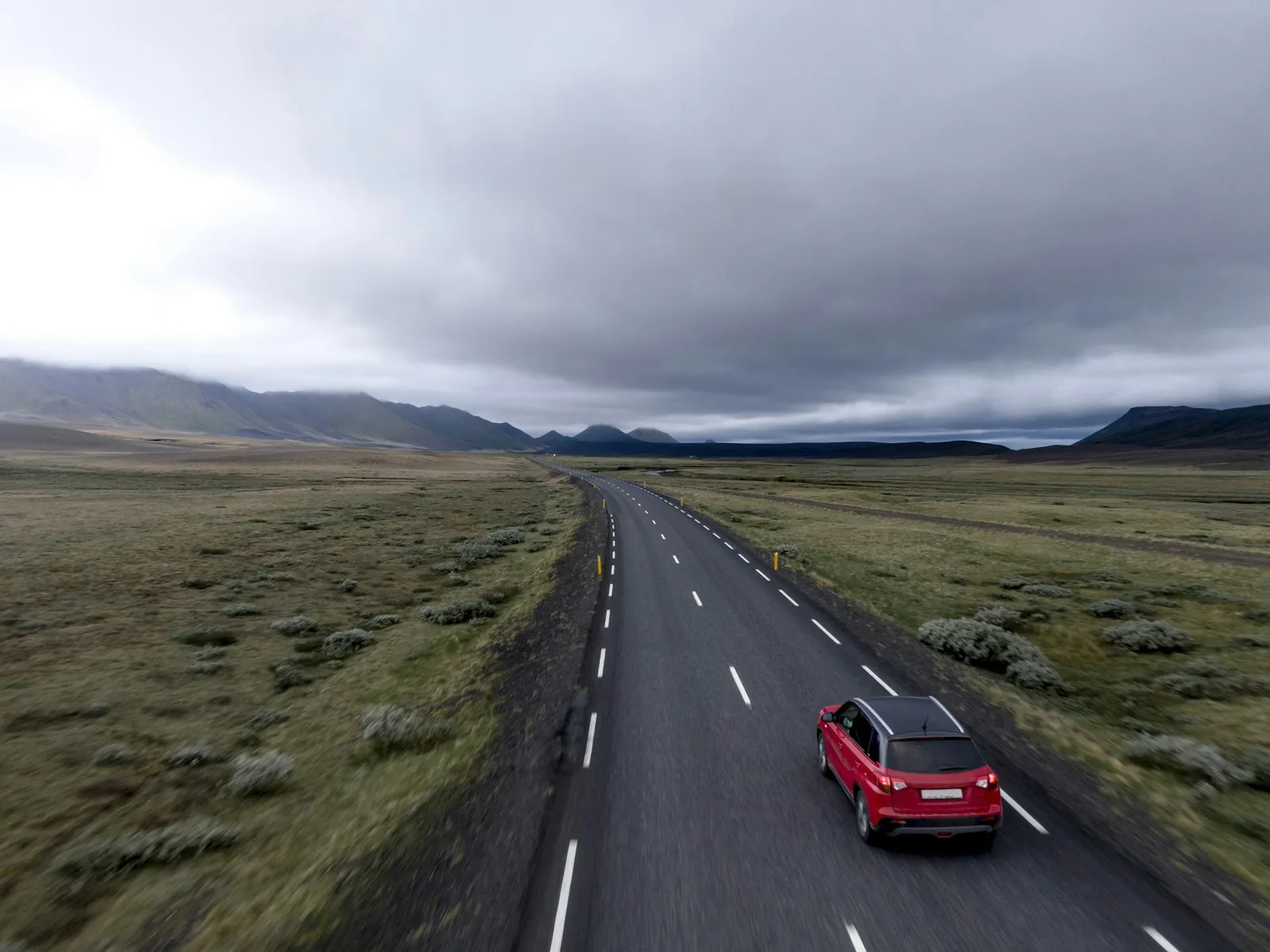 A view along a country road from behind the wheel of a car