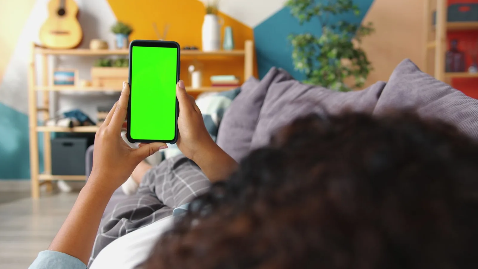 A person browsing listings on a phone