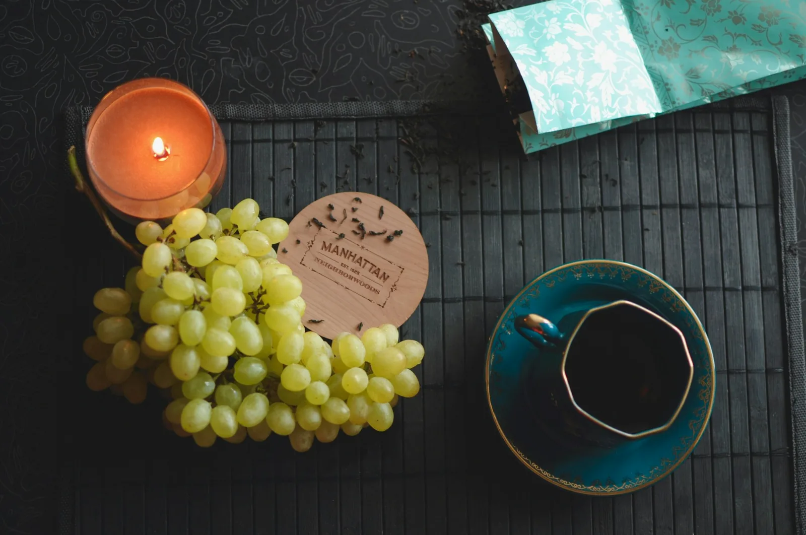 Chocolate and grapes sitting on a kitchen table