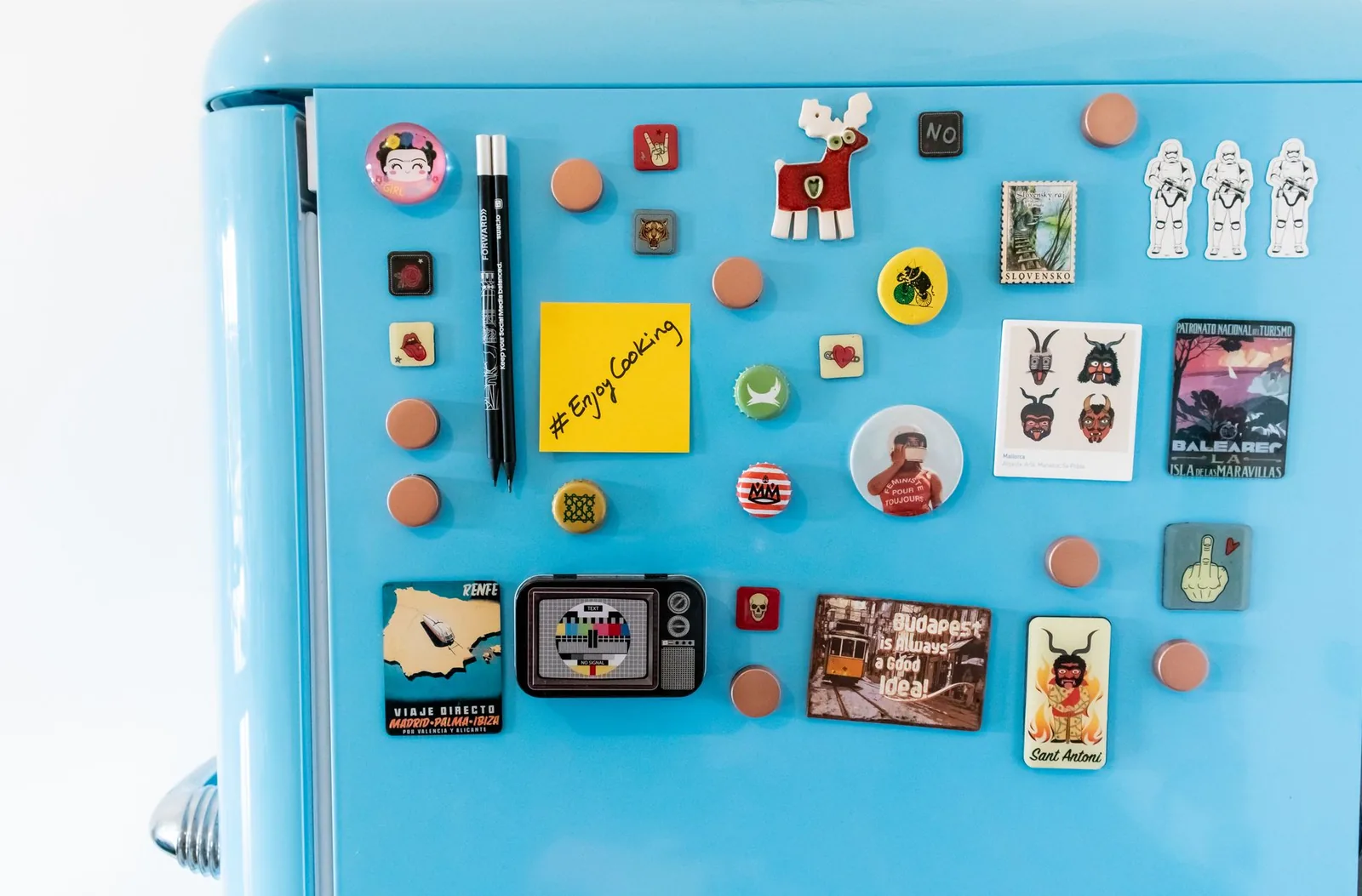 A handwritten note attached to a refrigerator door