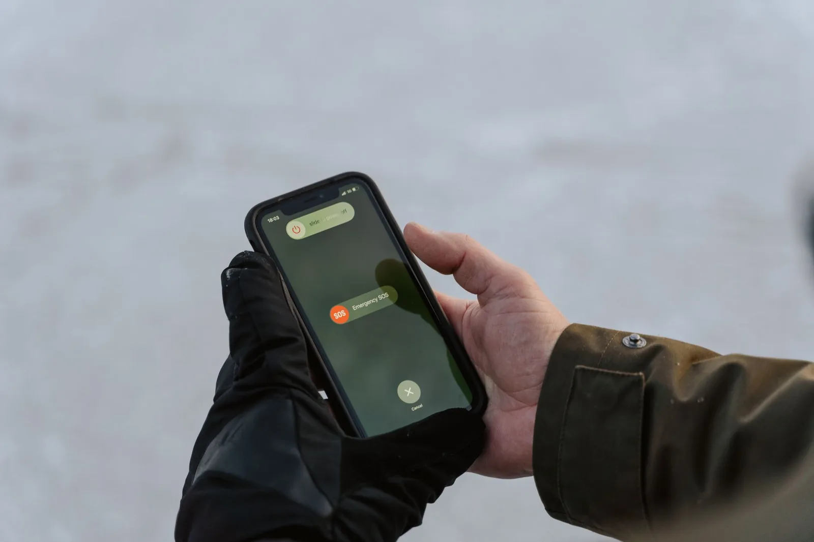 A person making a phone call while holding a note