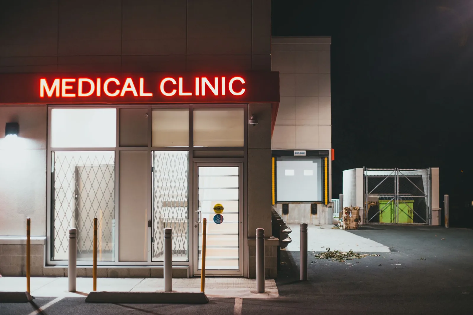 A veterinary clinic entrance lit in the evening