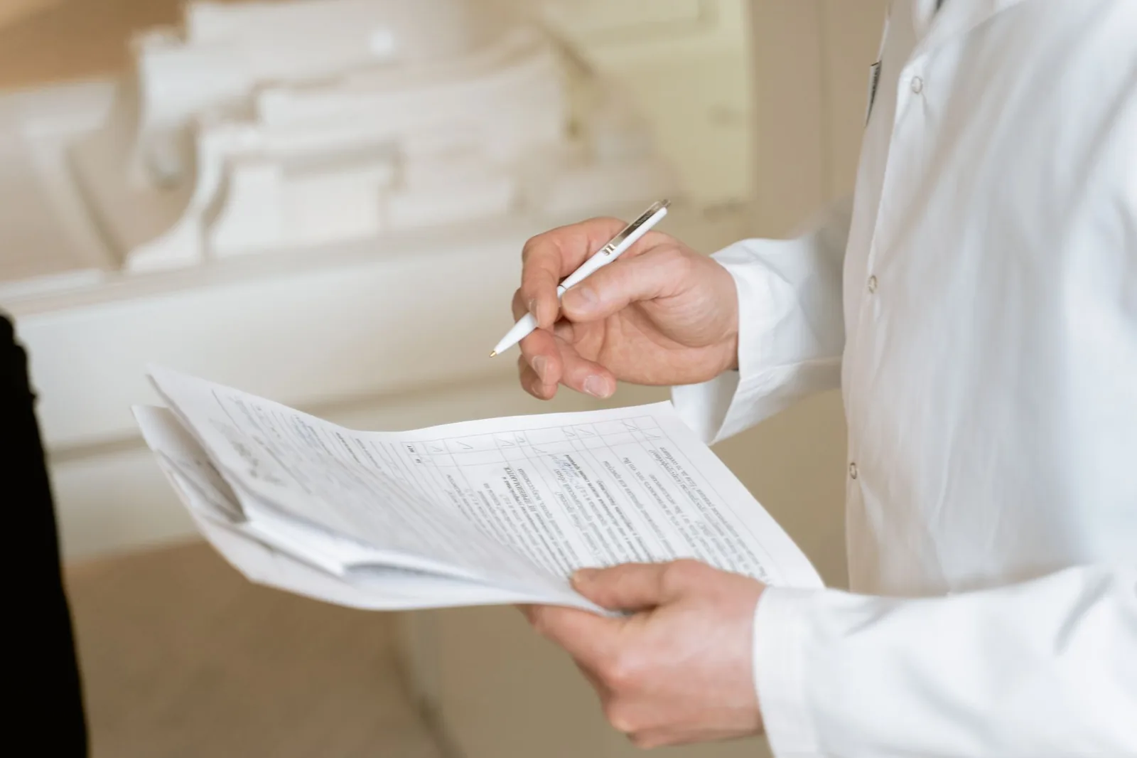 A veterinarian reviewing paperwork with an owner