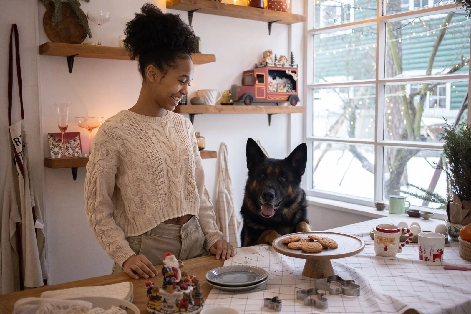 A foster carer with a dog at home