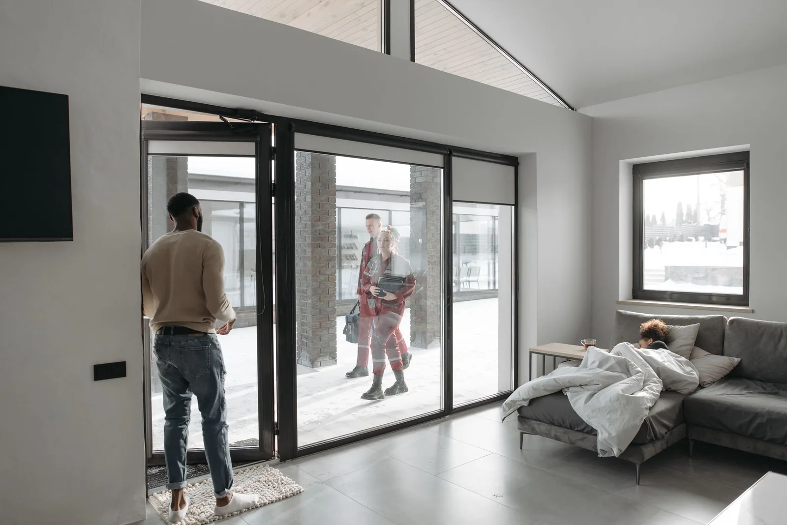 A front door open as guests arrive