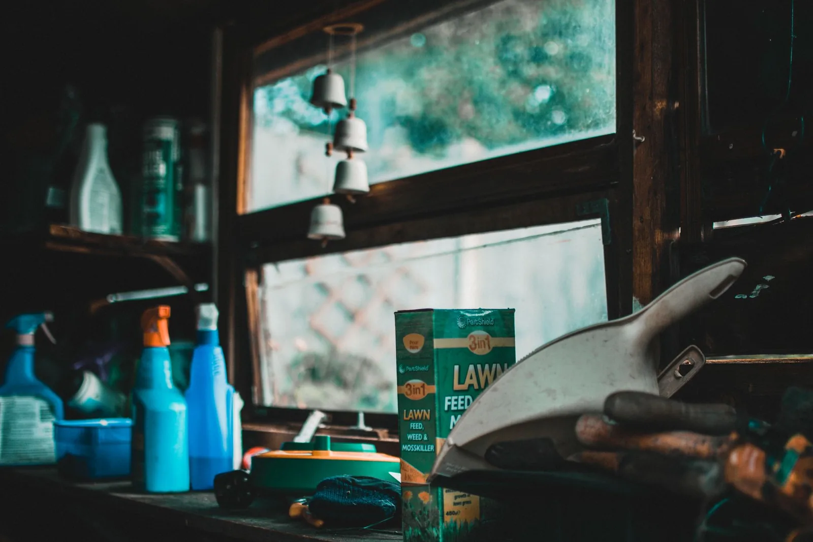 A garden shed with tools and containers
