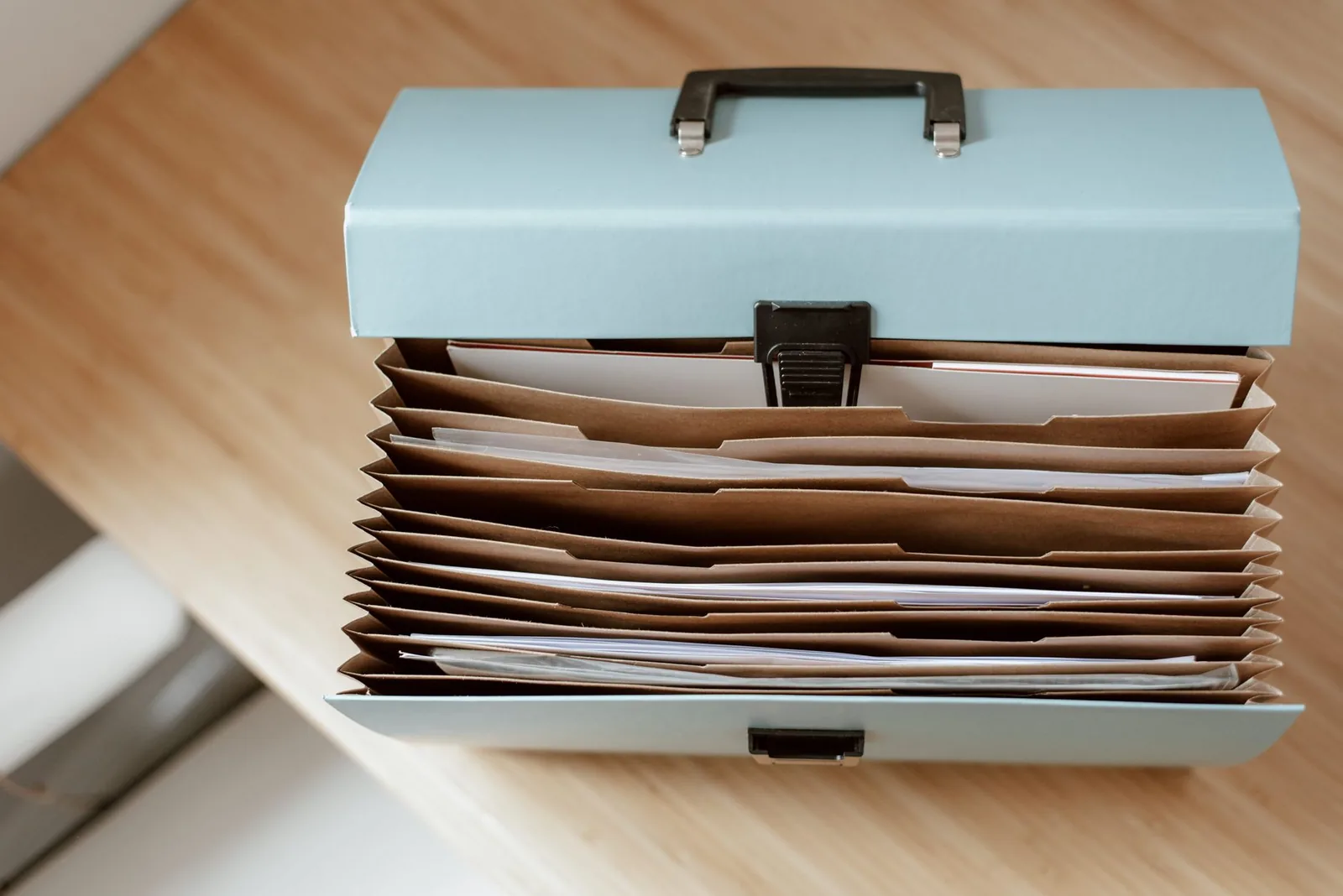 Documents and a dog lead on a table