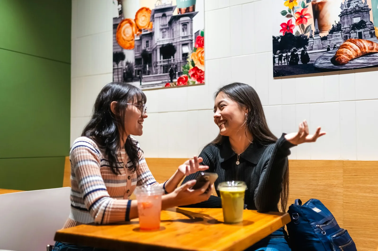 Two people talking across a table