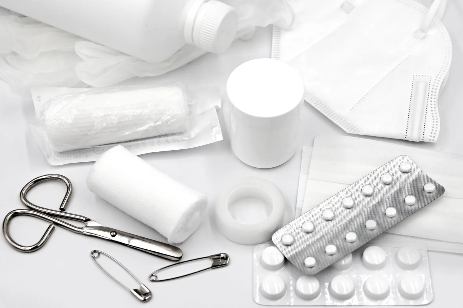 First aid supplies laid out including bandages and gauze