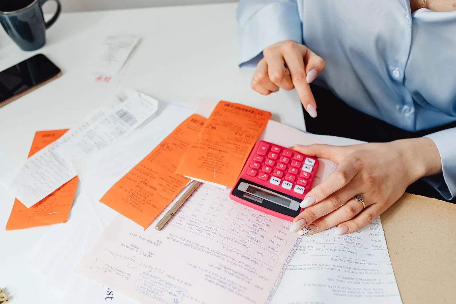 A calculator and receipts on a desk
