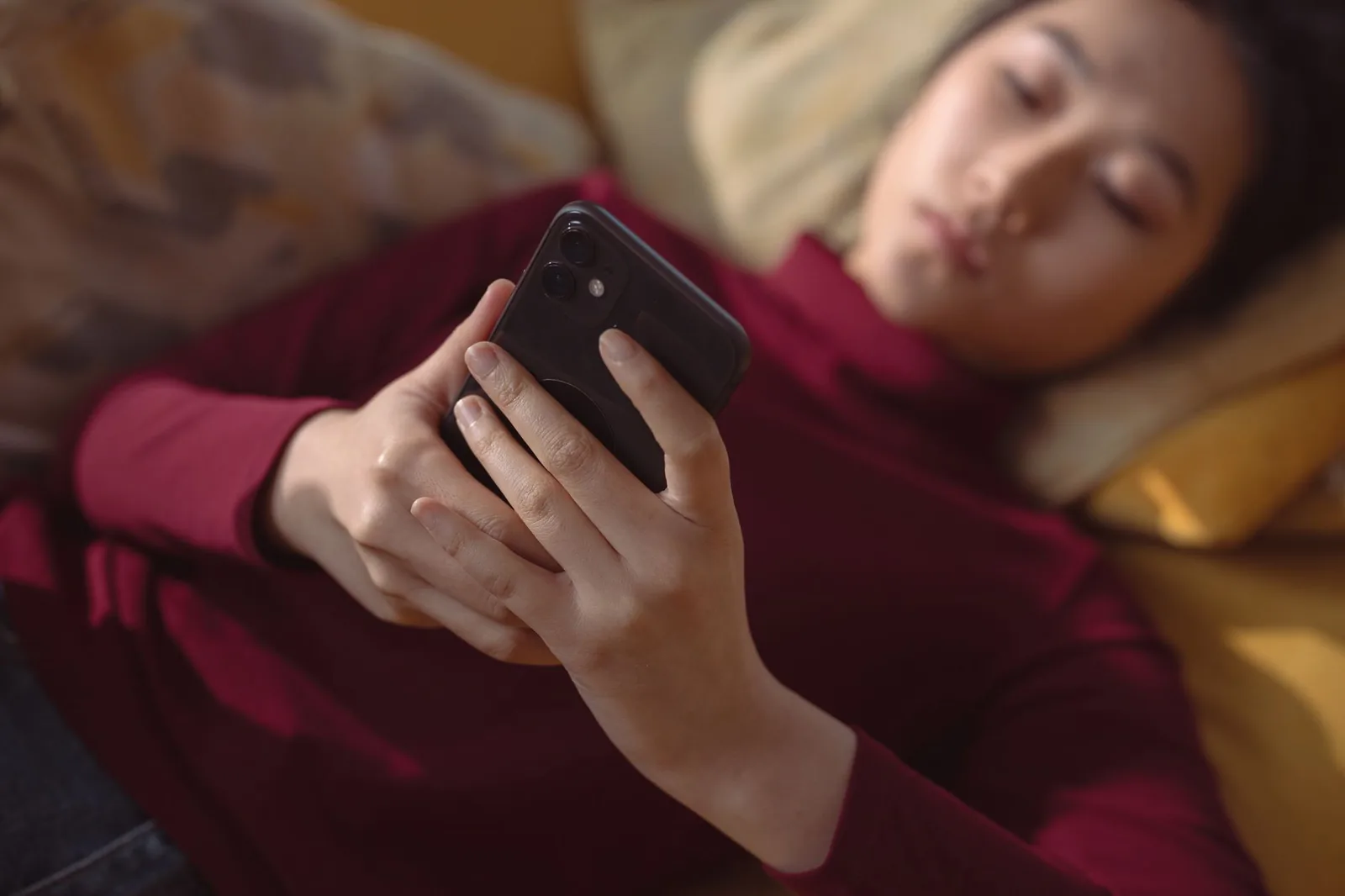 A person making a phone call at home