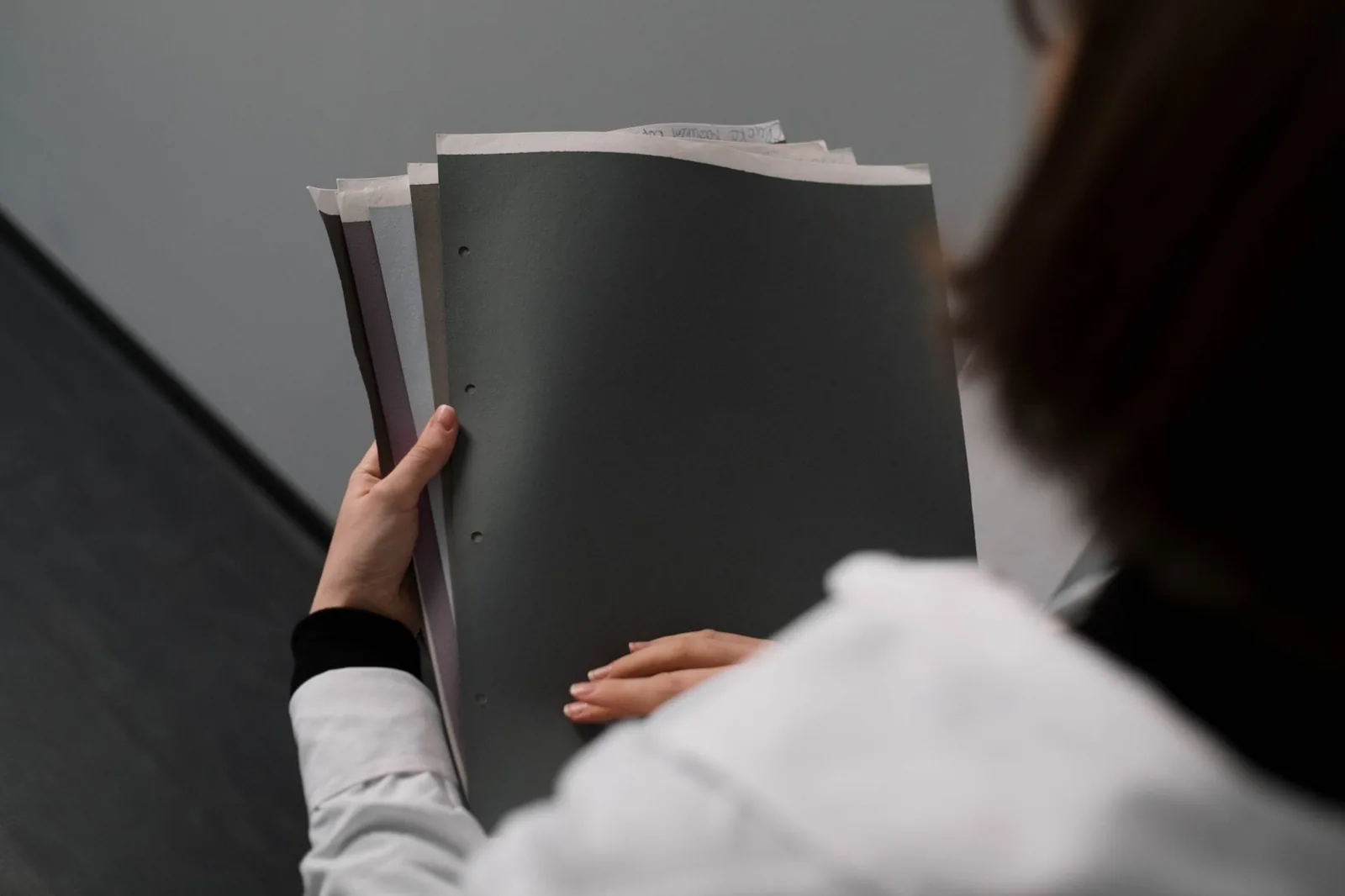 A person reading paperwork closely