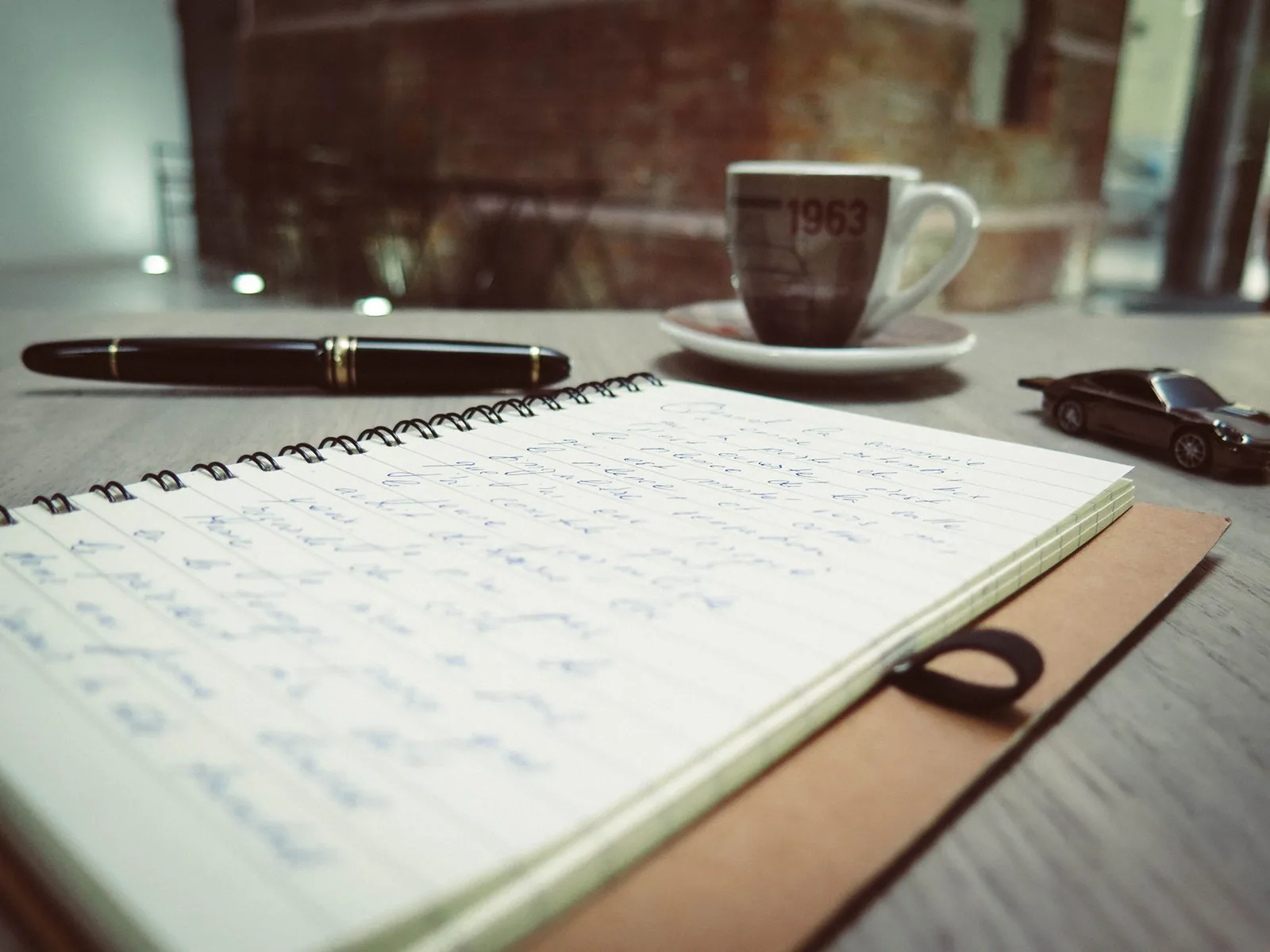 An open notebook and pen on a table