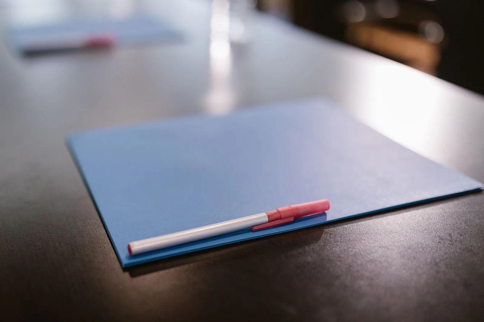A folder of documents laid out on a table