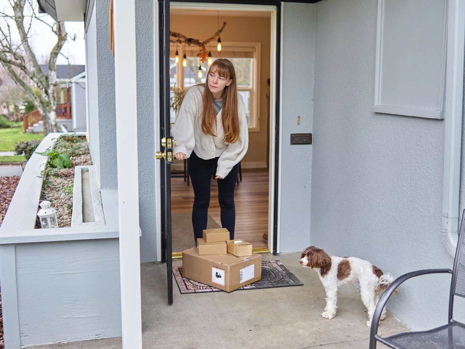 A dog greeting a visitor at the door