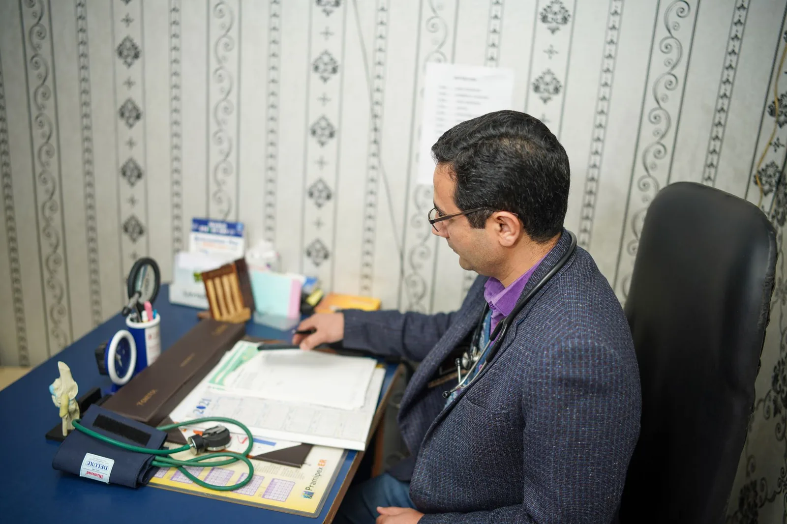 A folder of veterinary records open on a desk