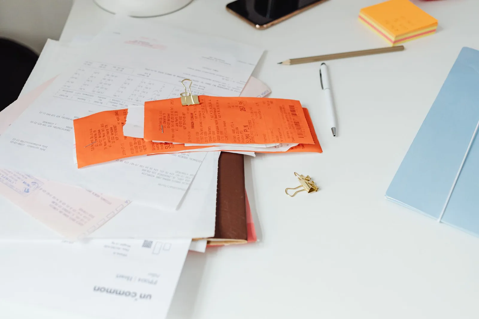 Veterinary invoices and paperwork on a desk