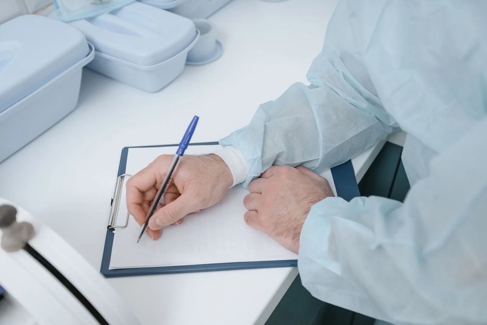 A clipboard of veterinary records on a desk
