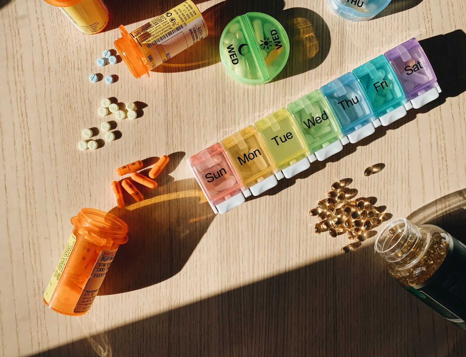 A weekly pill organizer on a kitchen counter