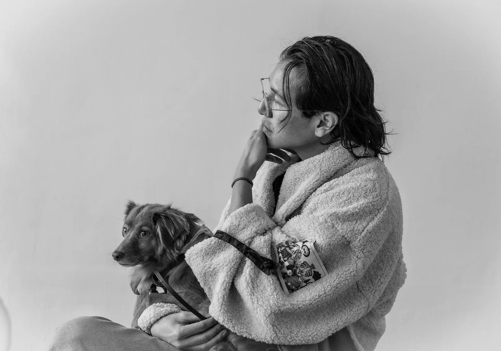 A person sitting quietly with a dog