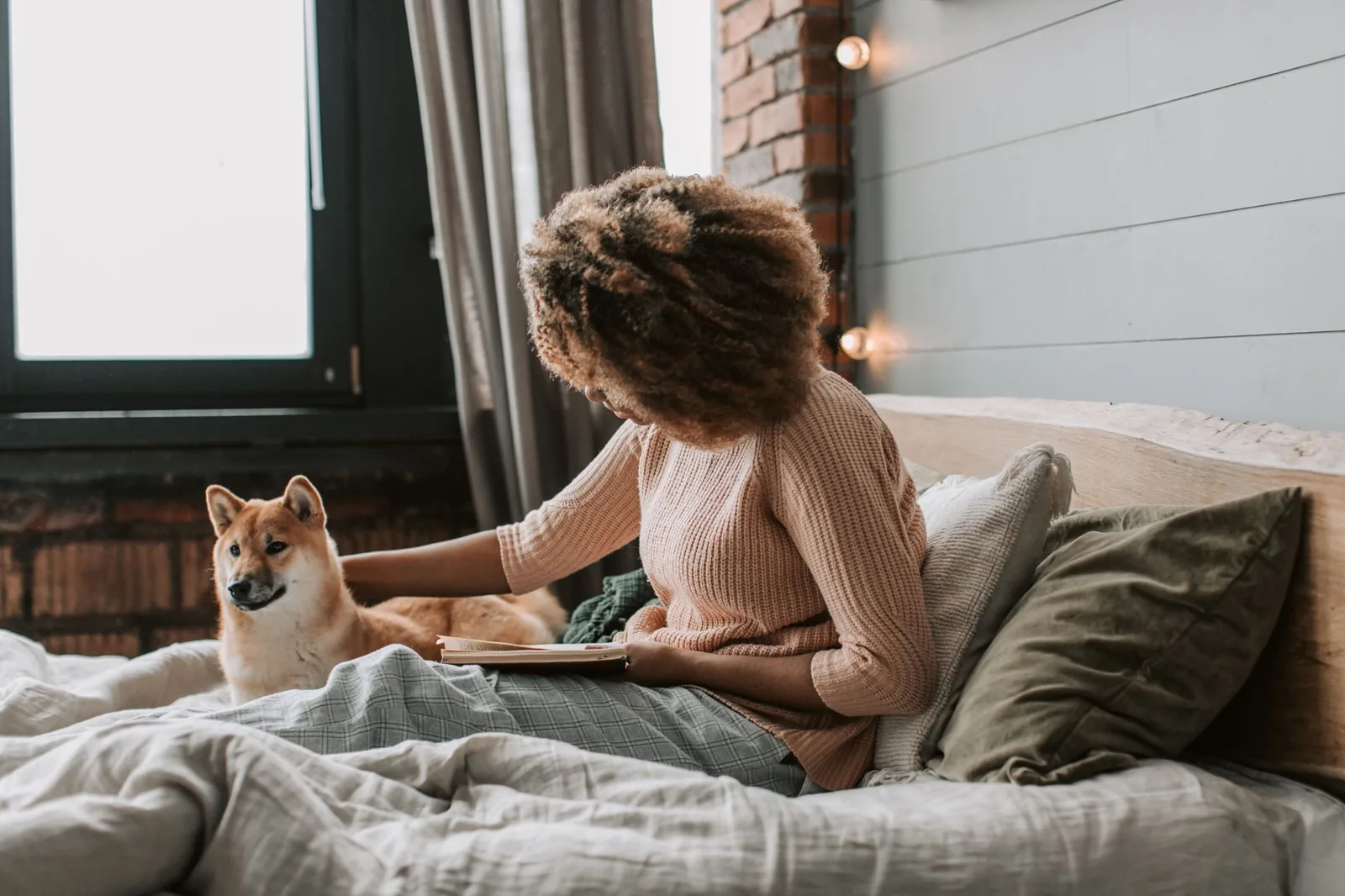 A person sitting quietly beside their dog